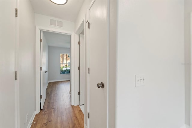 hall with light wood-type flooring