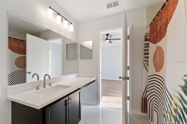 bathroom featuring vanity and ceiling fan