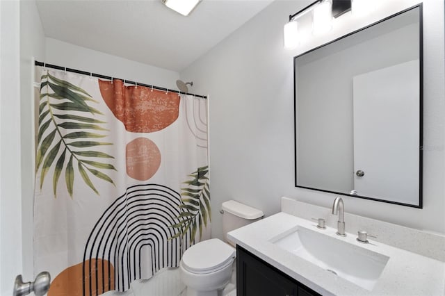 bathroom with vanity, toilet, and a shower with shower curtain