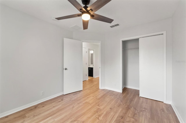 unfurnished bedroom with a closet, ceiling fan, and light wood-type flooring