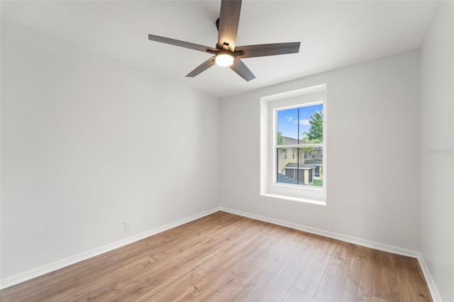 spare room featuring ceiling fan and light wood-type flooring