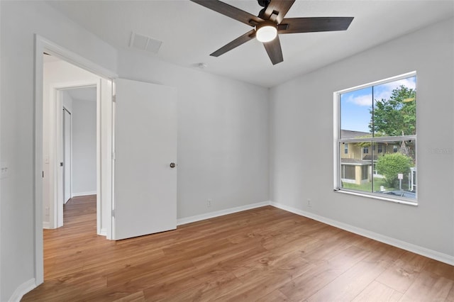 empty room featuring light hardwood / wood-style floors and ceiling fan