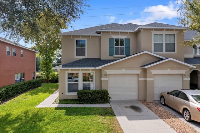 view of front facade with a garage and a front yard