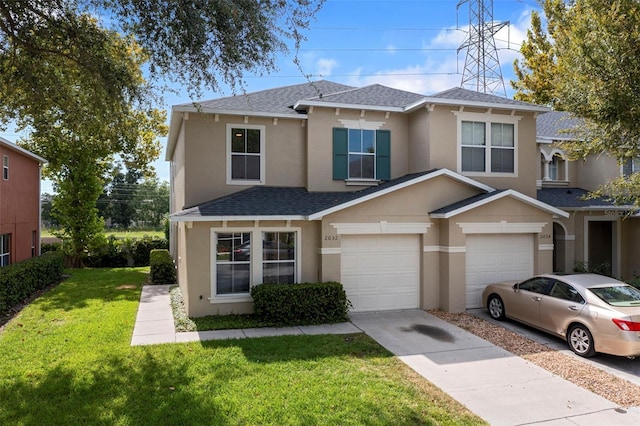 view of front of home featuring a garage and a front lawn