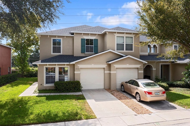 view of front of home with a garage and a front yard