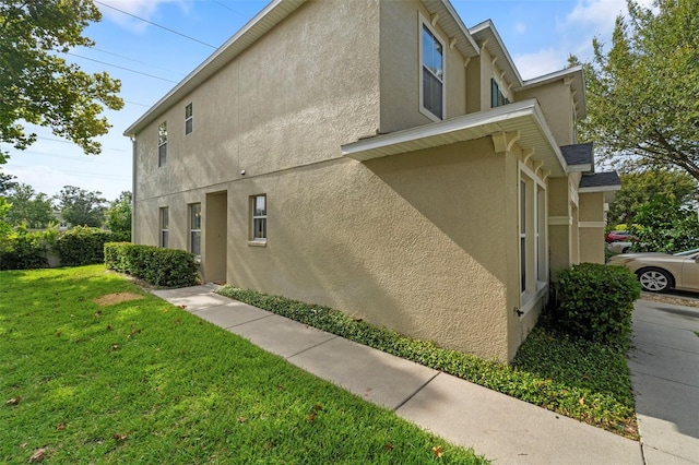 view of home's exterior featuring a yard