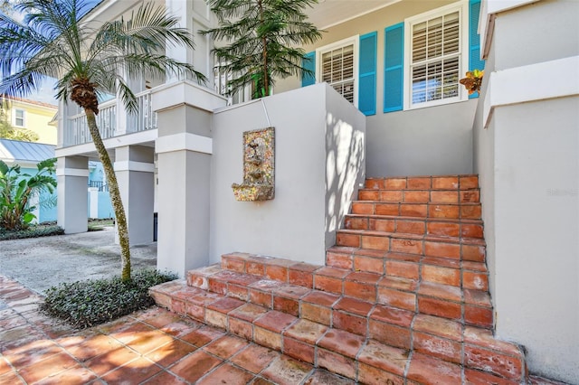 doorway to property with stucco siding