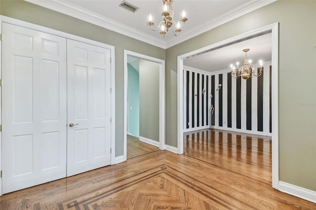 interior space with visible vents, crown molding, baseboards, and an inviting chandelier