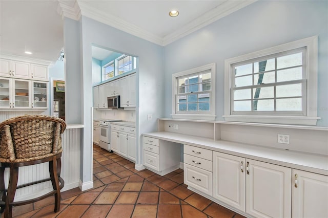 office space featuring recessed lighting, crown molding, and built in study area