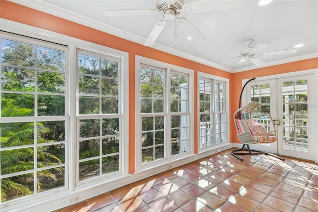 sunroom / solarium featuring ceiling fan and french doors