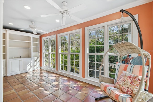 sunroom with ceiling fan