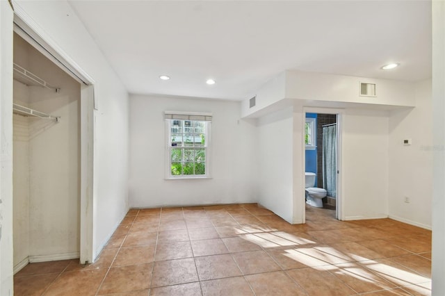 unfurnished bedroom featuring visible vents, a closet, and recessed lighting