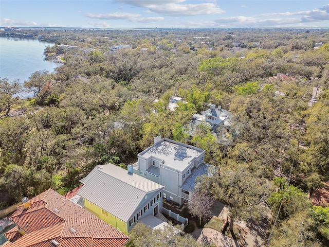 bird's eye view with a water view and a forest view