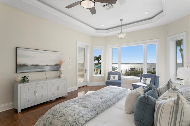 bedroom featuring access to exterior, visible vents, baseboards, a tray ceiling, and dark wood-style floors