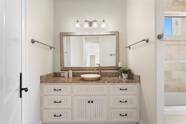 bathroom featuring vanity and washtub / shower combination