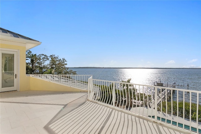 balcony featuring a water view