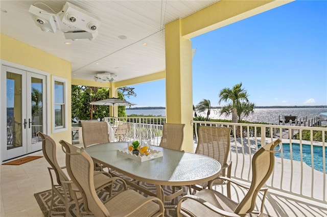 view of patio / terrace with a fenced in pool, french doors, outdoor dining area, and ceiling fan