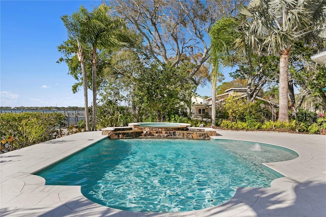 view of swimming pool with a pool with connected hot tub