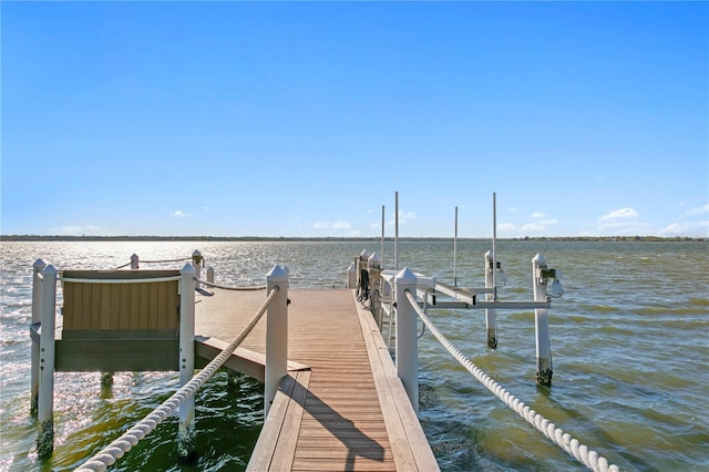 view of dock featuring a water view and boat lift