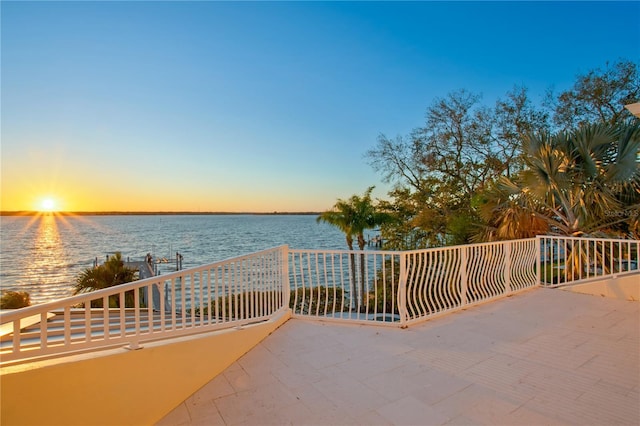 view of patio with a water view