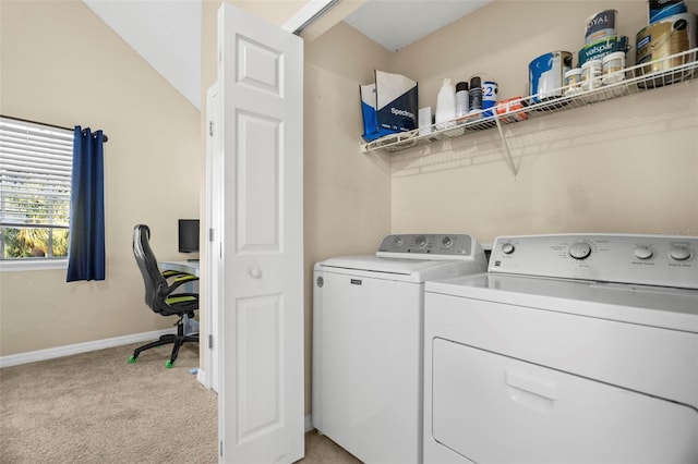 washroom with light colored carpet and washing machine and clothes dryer