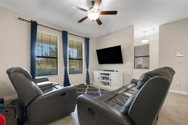 living room with light tile patterned floors and ceiling fan