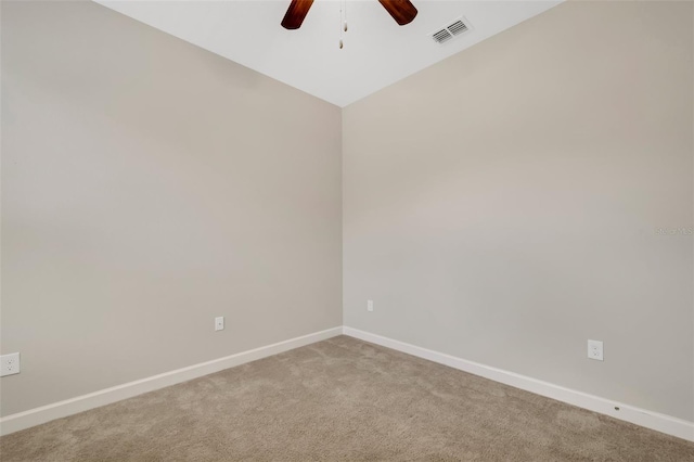 spare room with ceiling fan and carpet flooring