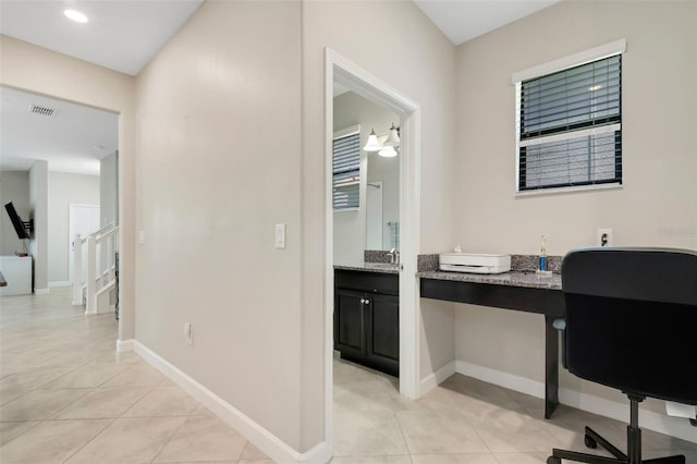 home office with light tile patterned floors