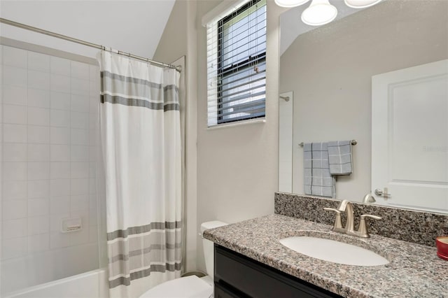 full bathroom with vanity, toilet, and shower / tub combo