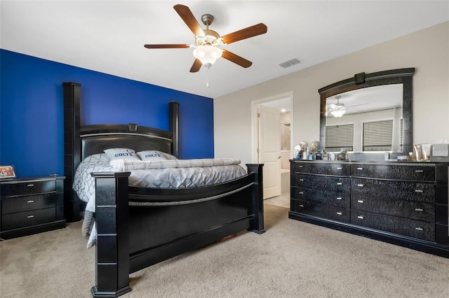 bedroom featuring ceiling fan and light carpet