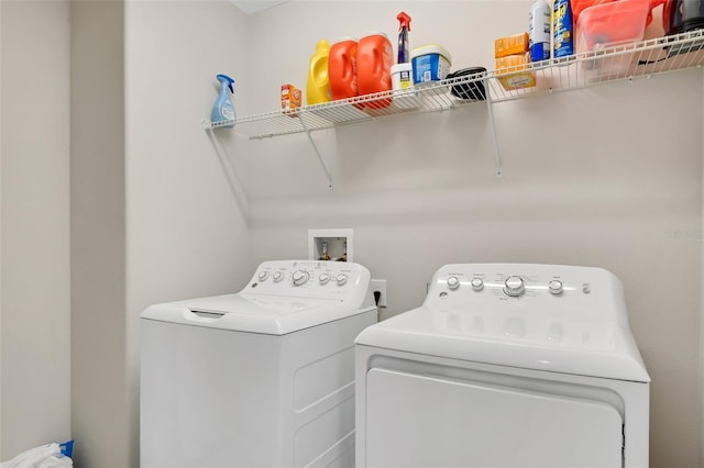 washroom with washing machine and dryer