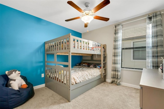 bedroom featuring ceiling fan and light colored carpet