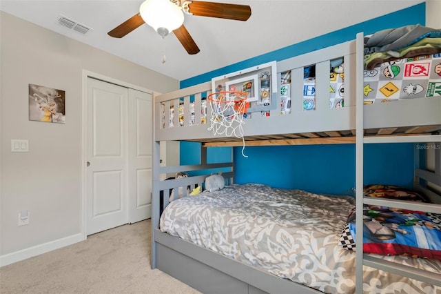 bedroom featuring a closet, ceiling fan, and carpet