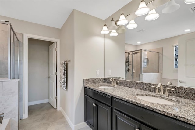 bathroom with vanity, an enclosed shower, and tile patterned floors