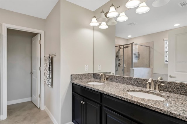 bathroom featuring walk in shower and vanity