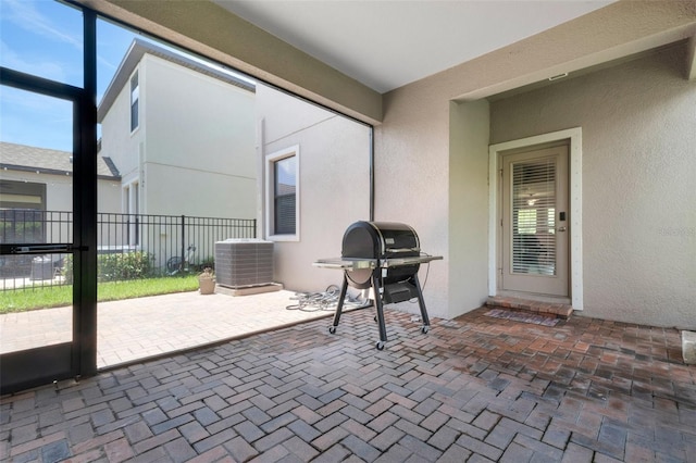 view of patio featuring a grill and central air condition unit