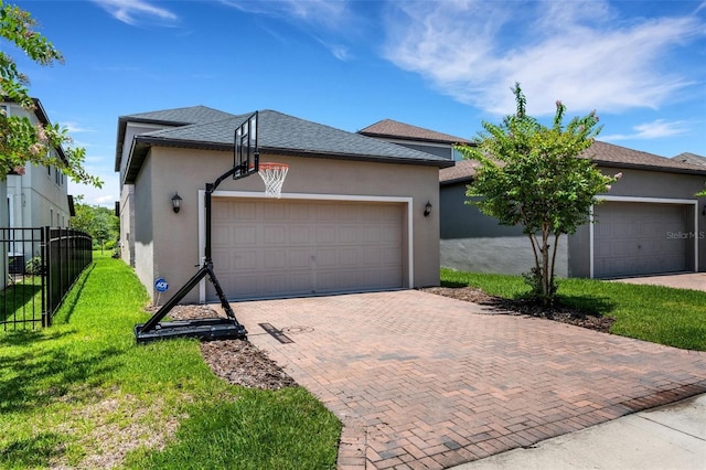 view of front facade with a garage and a front yard