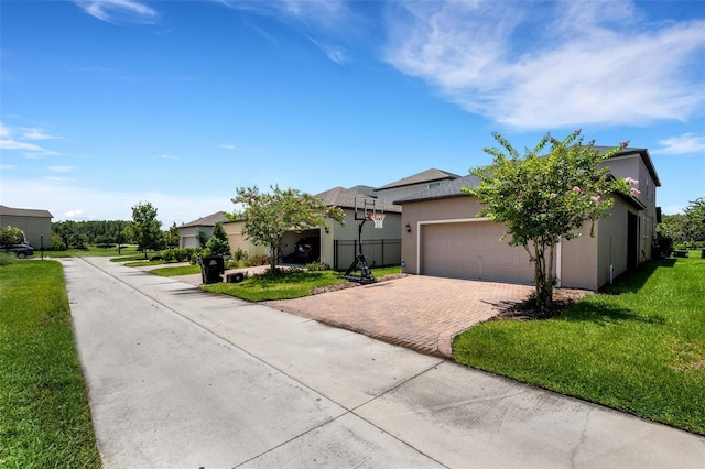 view of front of property featuring a garage and a front lawn