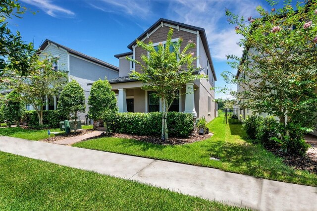 view of front facade with a front yard