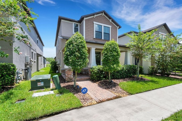 craftsman house with a front yard