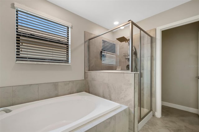 3568 Pine Ribbon Dr, Land O Lakes, FL 34638 - bathroom featuring a garden tub, a stall shower, and recessed lighting