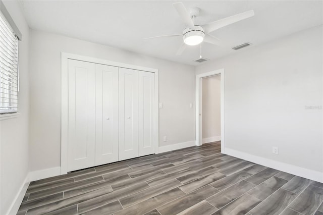 unfurnished bedroom featuring a closet, visible vents, and baseboards