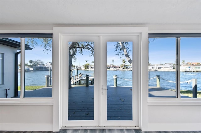 doorway to outside featuring a water view