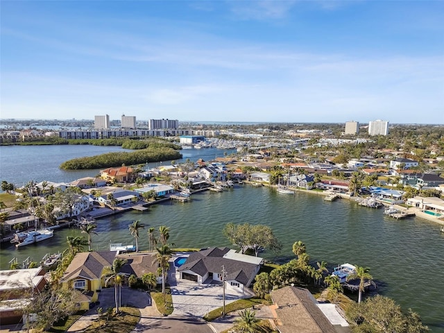 birds eye view of property featuring a view of city and a water view