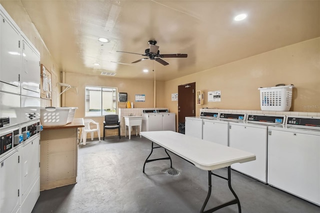 interior space featuring separate washer and dryer, stacked washer and clothes dryer, sink, and ceiling fan