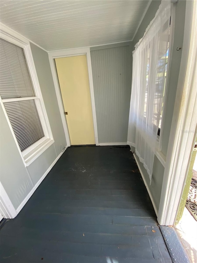 corridor featuring dark hardwood / wood-style flooring