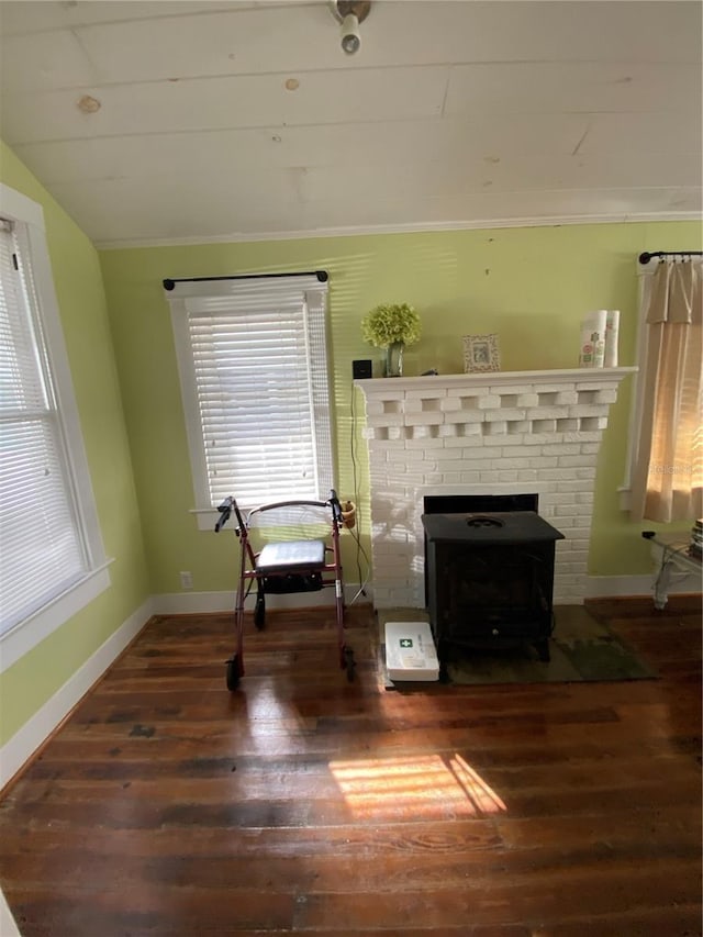 living area with dark wood-type flooring and vaulted ceiling