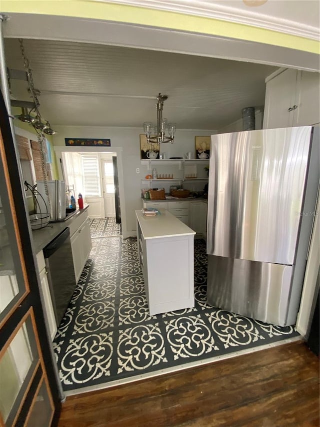 kitchen featuring white cabinetry, stainless steel appliances, dark hardwood / wood-style floors, and a center island