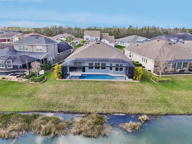 drone / aerial view with a water view