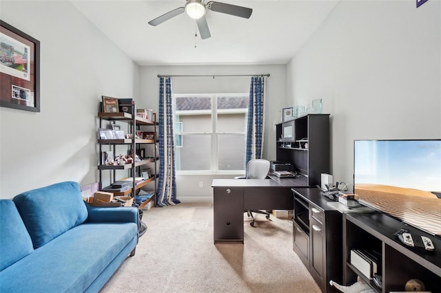 home office with ceiling fan and light colored carpet